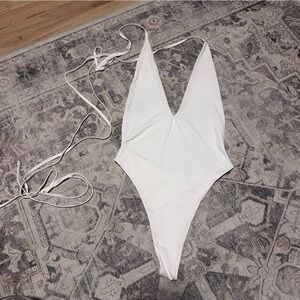 Sleek White One-Piece Swimwear with Plunging V-Neck